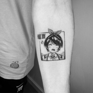 Minimalist anime tattoo in fine line style by an artist at Tizio Art in Antwerp