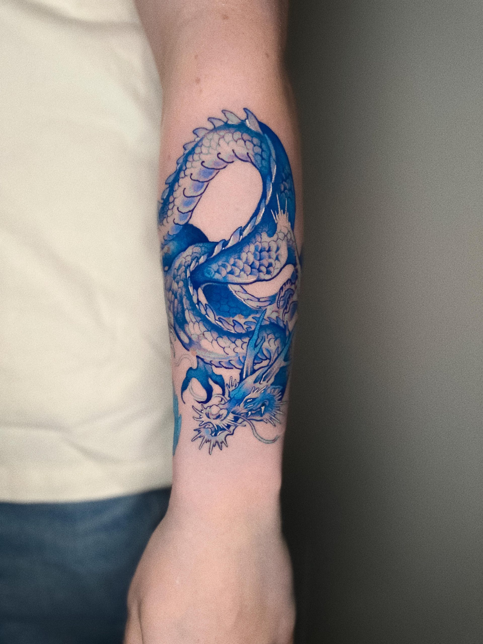 Blue dragon Neo Japanese tattoo symbolizing wisdom, water, and spiritual protection, inspired by traditional Japanese folklore.